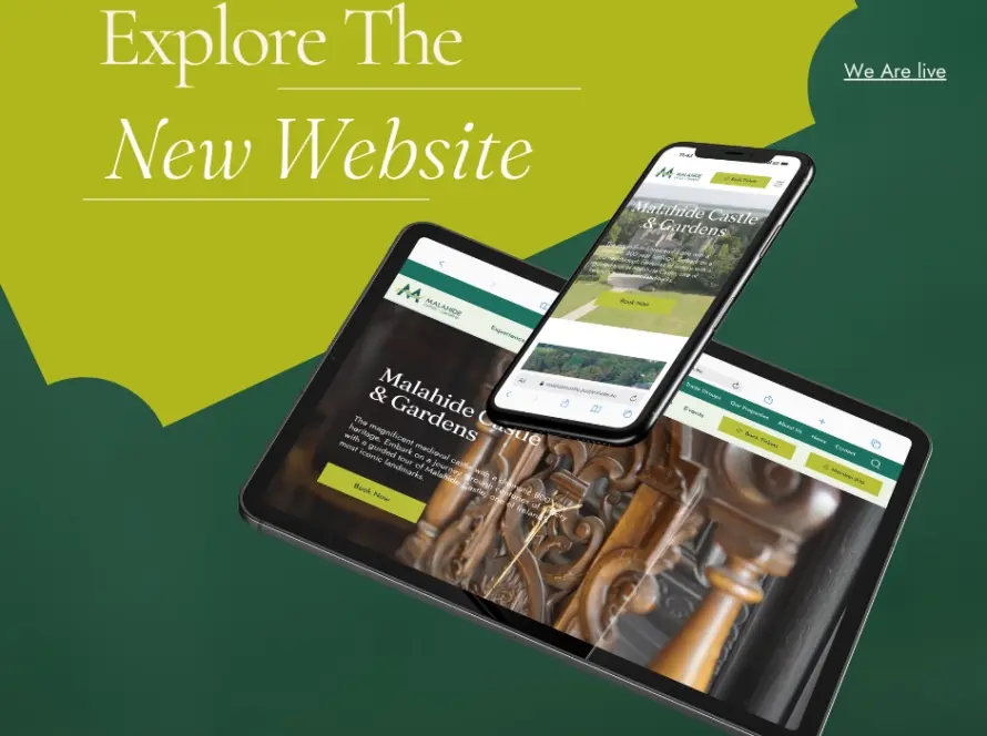 A tablet and smartphone display the Malahide Castle and Gardens website, featuring ornate wooden door details. The background is green with the text "Explore The New Website" and "We Are Live." Embark on a virtual tour or enjoy whiskey tasting as you explore this historic gem.