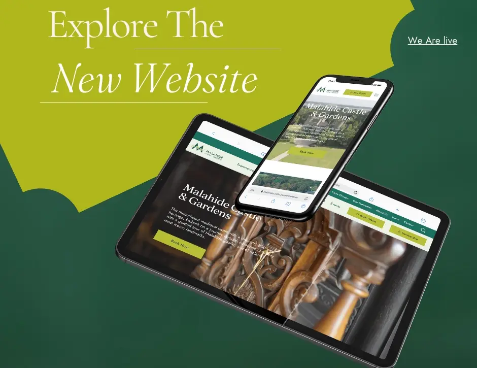 A tablet and smartphone display the Malahide Castle and Gardens website, featuring ornate wooden door details. The background is green with the text "Explore The New Website" and "We Are Live." Embark on a virtual tour or enjoy whiskey tasting as you explore this historic gem.