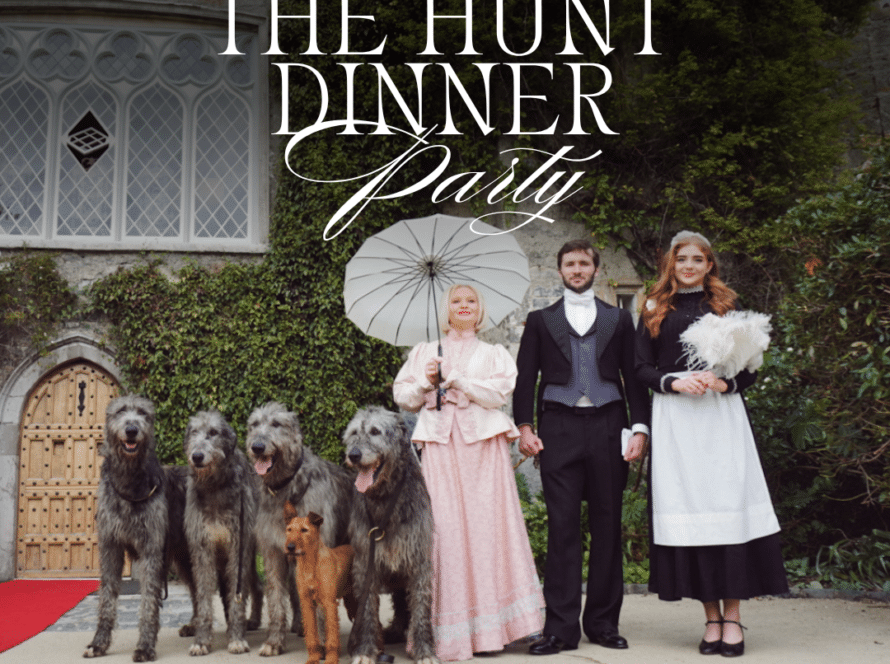 Three people in period costumes stand outside a large building with four large dogs and one smaller dog. One person holds a parasol. Text reads: "The Hunt Dinner Party at Malahide Castle. Every Saturday from 9th of May (Except concert nights).