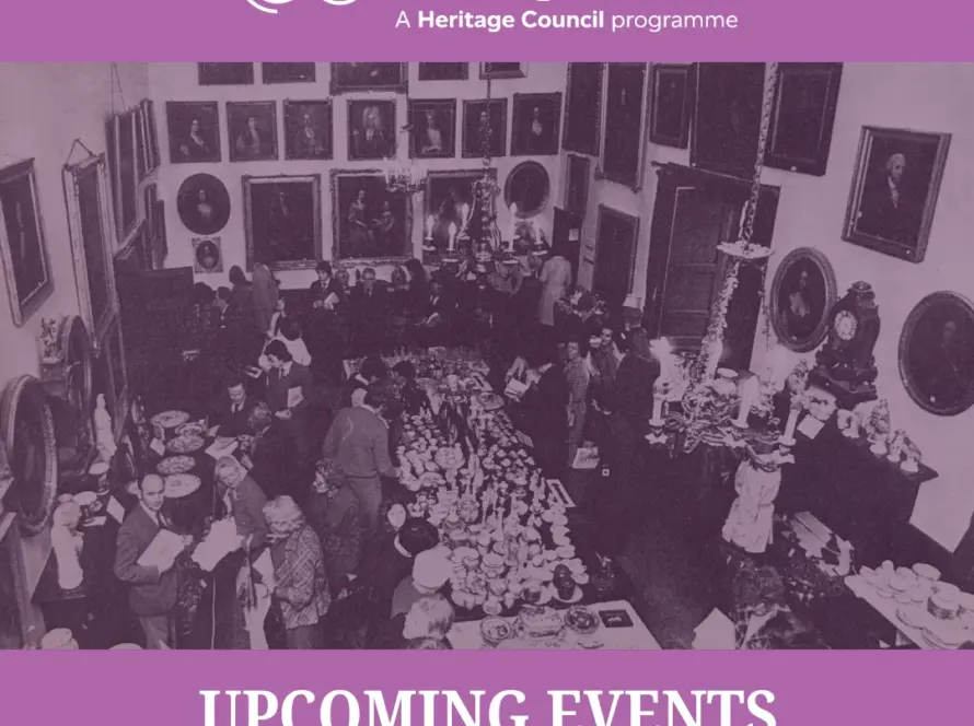 A sepia-toned photo of people at a large indoor gathering, surrounded by tables with various items and framed portraits. Text reads: “National Heritage Week - Upcoming Events at Malahide Castle & Gardens.”.