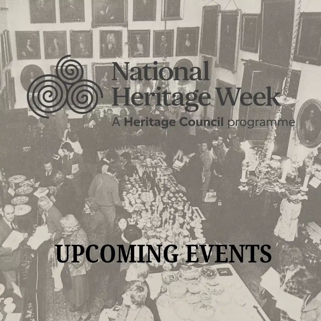 A historical black-and-white photo of people browsing tables with antiques and ceramics, overlaid with the National Heritage Week logo and “UPCOMING EVENTS,” celebrates the spirit of National Heritage Week. Many framed portraits hang on the walls.