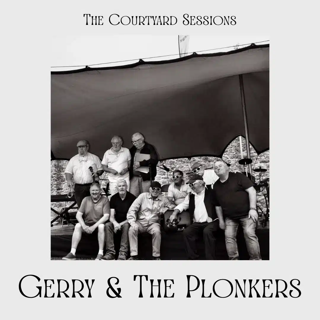 Black and white photo of ten men posing together on a stage under a canopy. Text above reads "The Courtyard Sessions" and below, "Gerry & The Plonkers."