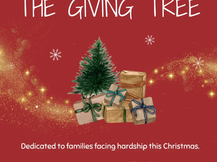 A decorated Christmas tree surrounded by wrapped gifts on a red background with sparkles. Text reads: "THE GIVING TREE. Dedicated to families facing hardship this Christmas."